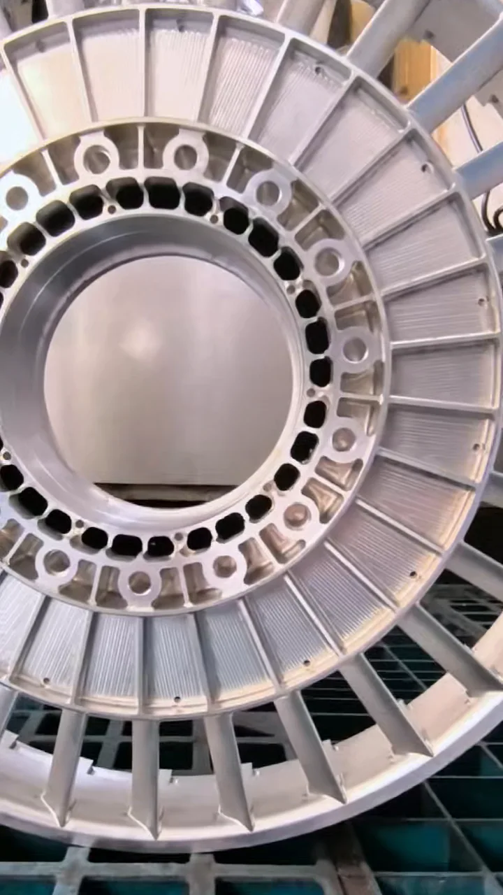 Close-up of the impeller opposite face showing the central opening, radial features, and visible machining texture