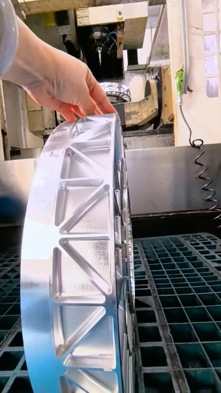 Side view of the featured impeller showing its outer profile and repeated machined features